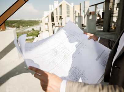 architect examining blueprints on construction sit 2026 01 09 00 32 36 utc
