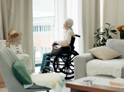 senior woman in wheelchair looking out window 2026 03 25 02 43 52 utc